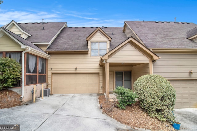 2551 Village Creek Lndg SE, Atlanta, GA 30316 - multi unit property with concrete driveway, an attached garage, cooling unit, and roof with shingles