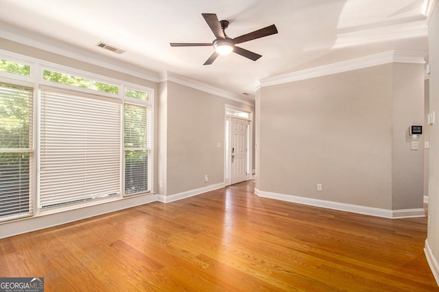2551 Village Creek Lndg SE, Atlanta, GA 30316 - empty room featuring a ceiling fan, crown molding, baseboards, and light wood finished floors