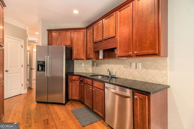 2551 Village Creek Lndg SE, Atlanta, GA 30316 - kitchen with appliances with stainless steel finishes, a sink, dark stone counters, light wood-style flooring, and recessed lighting