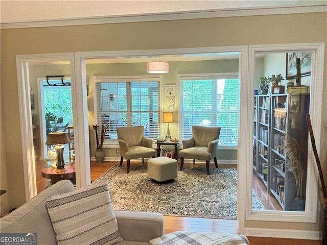 4025 Mcdowell Dr, Acworth, GA 30101 - living area with crown molding and wood finished floors