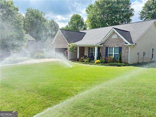4025 Mcdowell Dr, Acworth, GA 30101 - ranch-style house featuring brick siding, a front yard, and a garage
