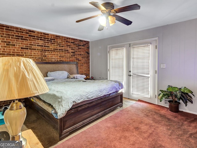 3059 Will Rogers Pl SE, Atlanta, GA 30316 - bedroom with access to exterior, a ceiling fan, carpet flooring, brick wall, and ornamental molding