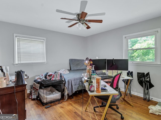 3059 Will Rogers Pl SE, Atlanta, GA 30316 - bedroom with wood-type flooring, a desk, ceiling fan, and baseboards