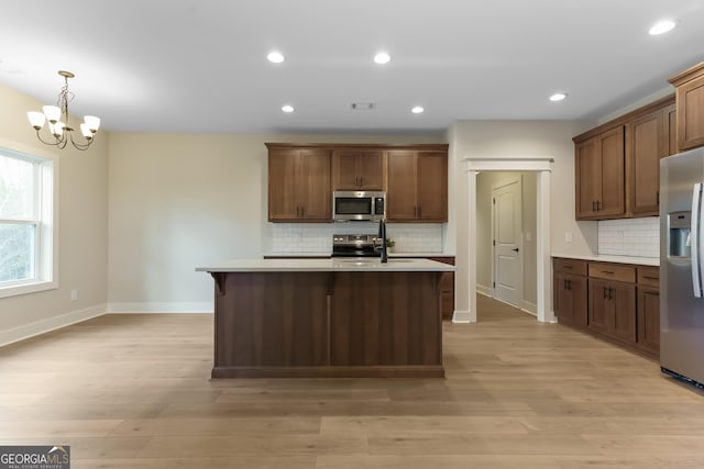 113 Summit View Ln, Ellijay, GA 30540 - kitchen with stainless steel appliances, light countertops, decorative backsplash, baseboards, and recessed lighting