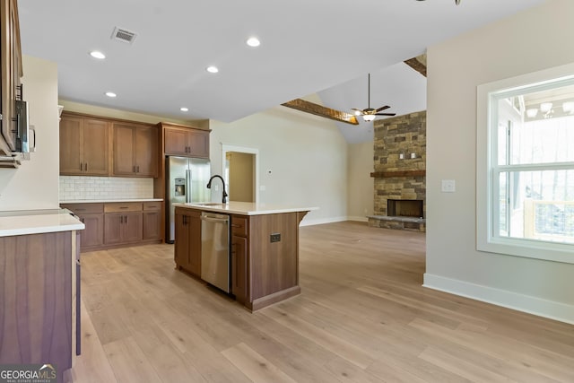 113 Summit View Ln, Ellijay, GA 30540 - kitchen with stainless steel appliances, ceiling fan, decorative backsplash, light countertops, and open floor plan
