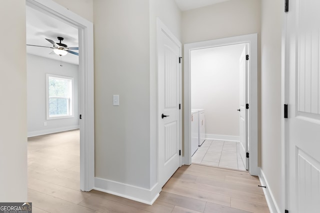 113 Summit View Ln, Ellijay, GA 30540 - hall featuring washer and dryer, light wood-type flooring, and baseboards