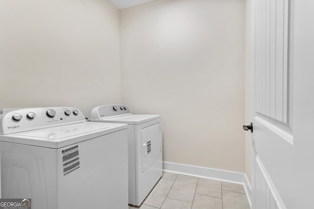 113 Summit View Ln, Ellijay, GA 30540 - clothes washing area with washing machine and dryer, light tile patterned flooring, and baseboards