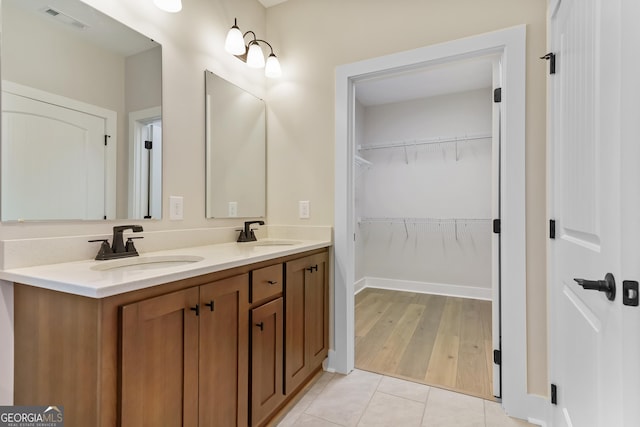 113 Summit View Ln, Ellijay, GA 30540 - bathroom with double vanity, a spacious closet, and tile patterned flooring