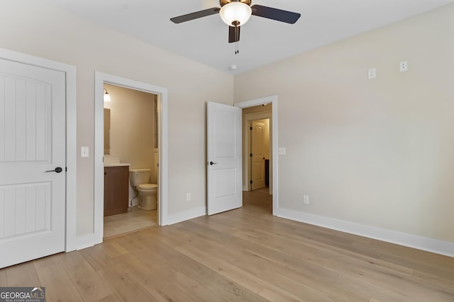 113 Summit View Ln, Ellijay, GA 30540 - unfurnished bedroom featuring baseboards, light wood finished floors, connected bathroom, and ceiling fan