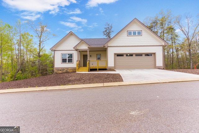 113 Summit View Ln, Ellijay, GA 30540 - view of front of house with driveway, covered porch, and a garage