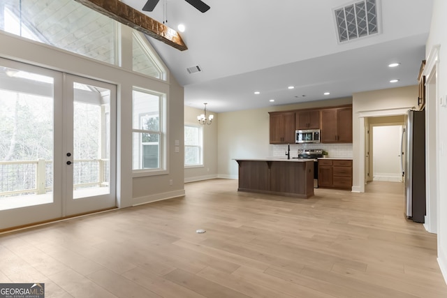 113 Summit View Ln, Ellijay, GA 30540 - kitchen with stainless steel appliances, high vaulted ceiling, a chandelier, a ceiling fan, and tasteful backsplash