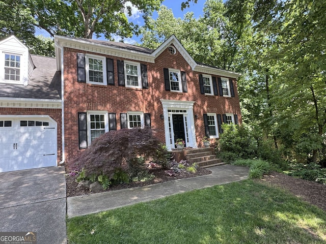 3146 Weymouth Dr, Marietta, GA 30062 - colonial home with brick siding, concrete driveway, a garage, and a front yard