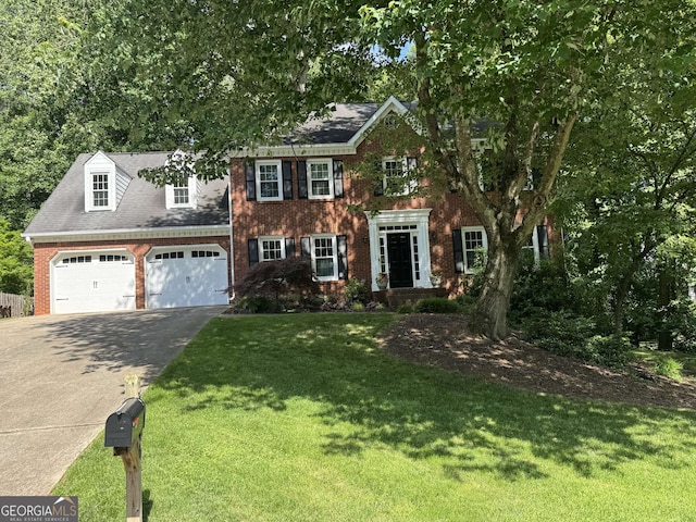 3146 Weymouth Dr, Marietta, GA 30062 - colonial home featuring brick siding, concrete driveway, a front lawn, and an attached garage