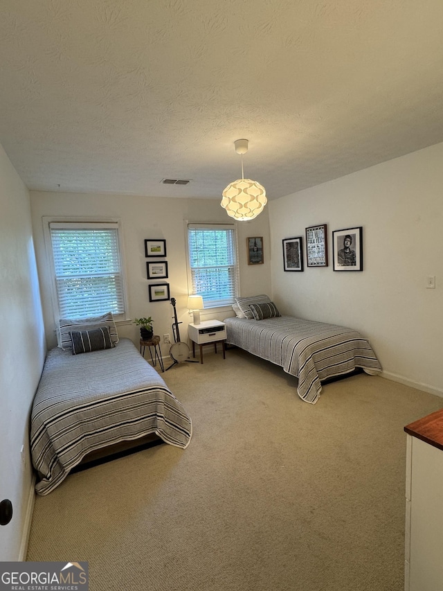 3146 Weymouth Dr, Marietta, GA 30062 - carpeted bedroom with baseboards and a textured ceiling