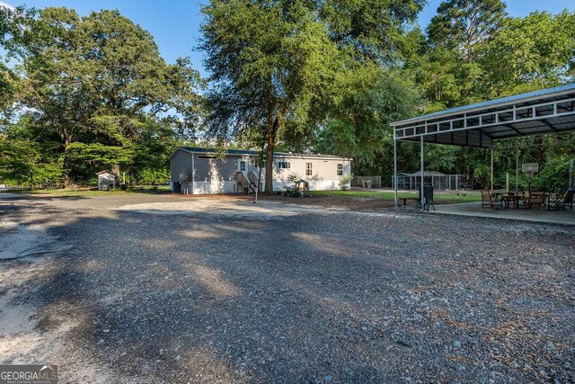 1208 Nease Rd, Guyton, GA 31312 - view of yard with view of wooded area