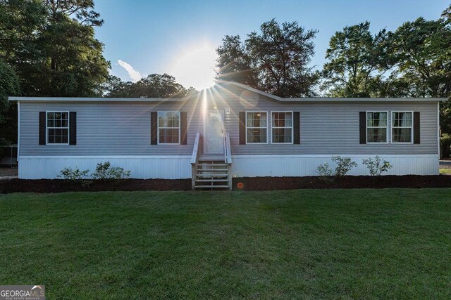 1208 Nease Rd, Guyton, GA 31312 - manufactured / mobile home featuring a front lawn