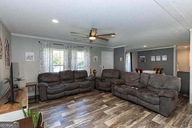 1208 Nease Rd, Guyton, GA 31312 - living area featuring wood finished floors, ceiling fan, crown molding, a textured ceiling, and recessed lighting