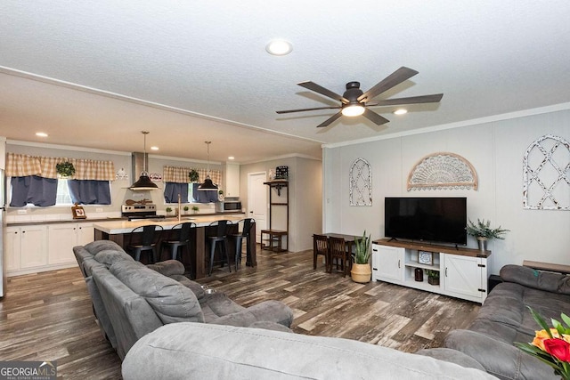 1208 Nease Rd, Guyton, GA 31312 - living room featuring ceiling fan, dark wood finished floors, crown molding, and recessed lighting
