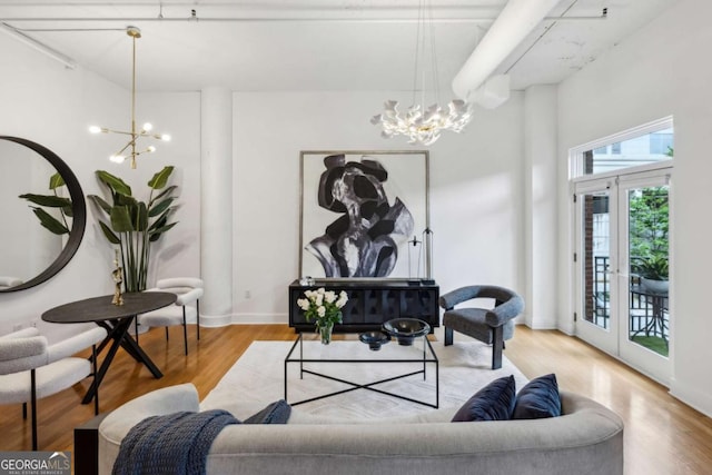 1058 Piedmont Ave Unit 103, Atlanta, GA 30309 - living area featuring a chandelier, french doors, and wood finished floors