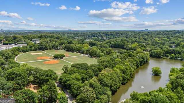 1058 Piedmont Ave Unit 103, Atlanta, GA 30309 - drone / aerial view of a forest and a nearby body of water