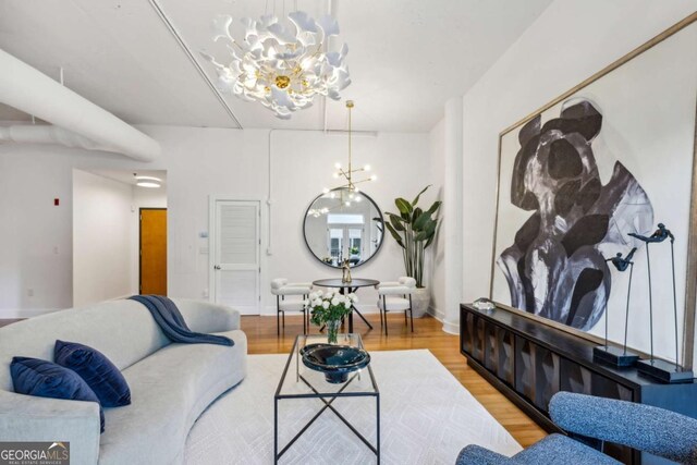 1058 Piedmont Ave Unit 103, Atlanta, GA 30309 - living area featuring a chandelier and light wood finished floors