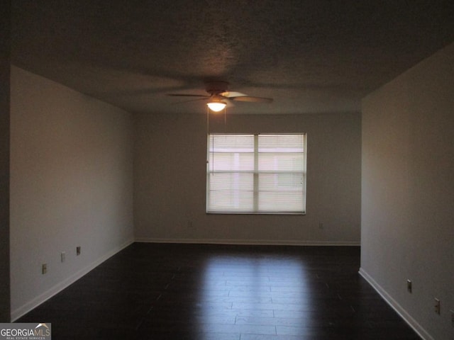 102 Westcliff Ctr Unit D, Warner Robins, GA 31093 - spare room with a ceiling fan, baseboards, and dark wood-style floors