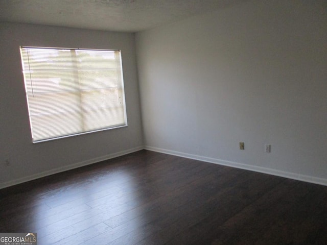 102 Westcliff Ctr Unit D, Warner Robins, GA 31093 - empty room with dark wood-style flooring and baseboards