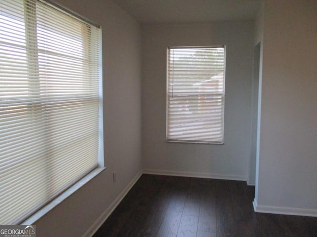 102 Westcliff Ctr Unit D, Warner Robins, GA 31093 - empty room featuring dark wood-type flooring and baseboards