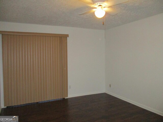 102 Westcliff Ctr Unit D, Warner Robins, GA 31093 - unfurnished room with dark wood-style floors, a textured ceiling, a ceiling fan, and baseboards