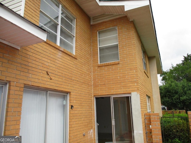 102 Westcliff Ctr Unit D, Warner Robins, GA 31093 - back of property featuring brick siding and fence