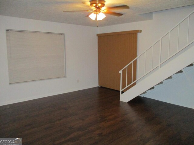 102 Westcliff Ctr Unit D, Warner Robins, GA 31093 - unfurnished room featuring wood finished floors, a ceiling fan, and stairs