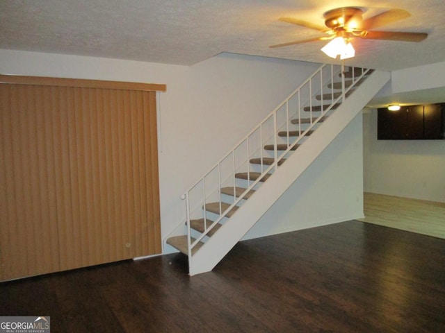 102 Westcliff Ctr Unit D, Warner Robins, GA 31093 - stairway with wood finished floors, a ceiling fan, and a textured ceiling