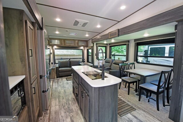 86 Moccasin Ln Unit 16, Blairsville, GA 30512 - kitchen featuring open floor plan, light wood-type flooring, a kitchen island, light countertops, and recessed lighting
