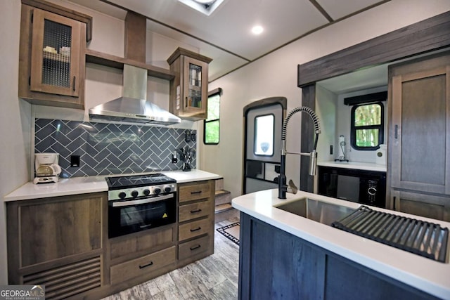 86 Moccasin Ln Unit 16, Blairsville, GA 30512 - kitchen with tasteful backsplash, light countertops, plenty of natural light, and glass insert cabinets