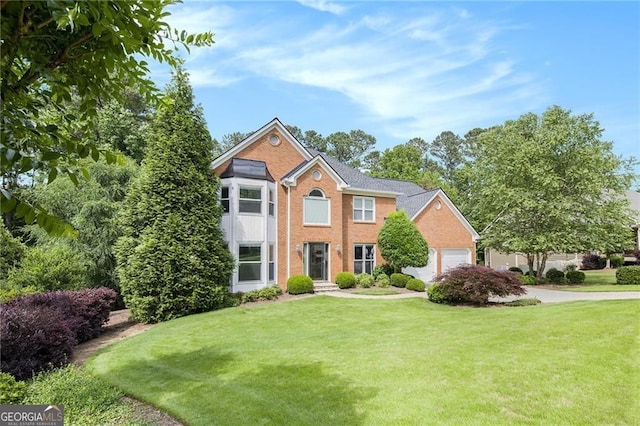 106 Waterford Pl, Acworth, GA 30101 - view of front of house featuring a front yard, an attached garage, and brick siding