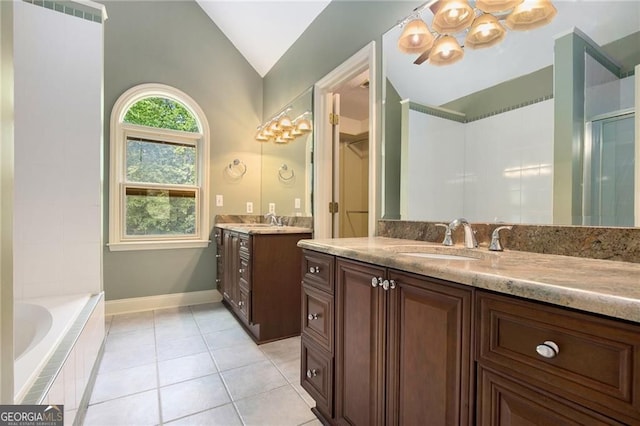 106 Waterford Pl, Acworth, GA 30101 - full bath featuring lofted ceiling, two vanities, a garden tub, a chandelier, and tile patterned floors