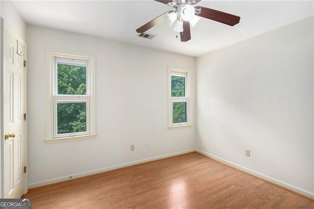 106 Waterford Pl, Acworth, GA 30101 - unfurnished room with plenty of natural light, light wood-type flooring, baseboards, and a ceiling fan