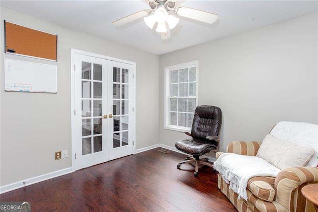 sitting room with french doors, wood finished floors, baseboards, and a ceiling fan