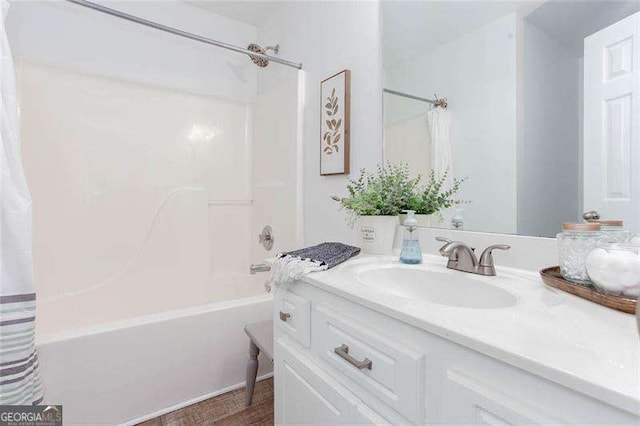 bathroom with shower / bath combo and vanity