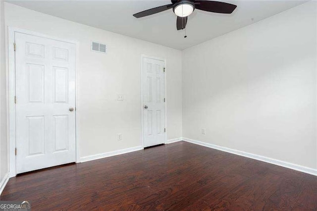 unfurnished bedroom with wood finished floors, baseboards, and ceiling fan