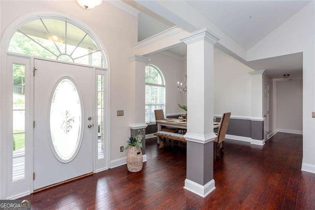 entryway featuring dark wood-style flooring, ornate columns, a chandelier, baseboards, and lofted ceiling