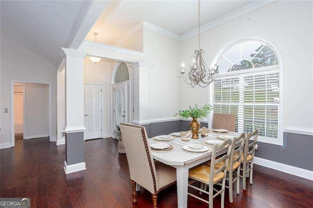 dining area featuring plenty of natural light, a chandelier, dark wood-style flooring, ornate columns, and ornamental molding