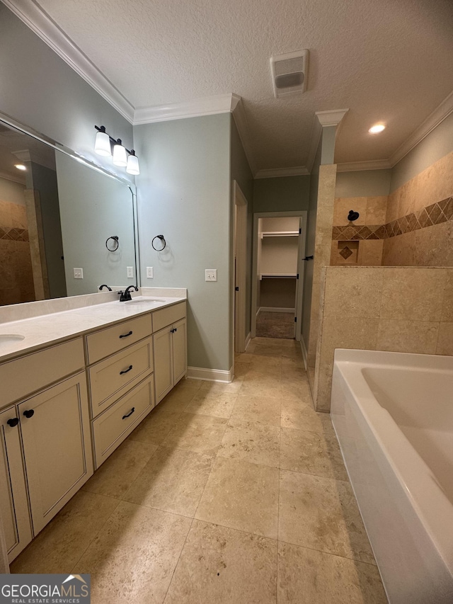 293 Laurel Landing Blvd, Kingsland, GA 31548 - bathroom with ornamental molding, double vanity, tiled shower, a bath, and a textured ceiling