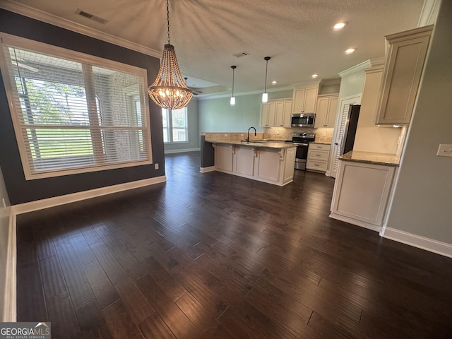 293 Laurel Landing Blvd, Kingsland, GA 31548 - kitchen featuring stainless steel appliances, baseboards, a sink, crown molding, and a chandelier