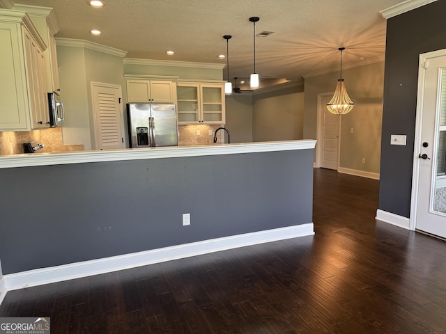 293 Laurel Landing Blvd, Kingsland, GA 31548 - kitchen featuring appliances with stainless steel finishes, glass insert cabinets, baseboards, crown molding, and recessed lighting