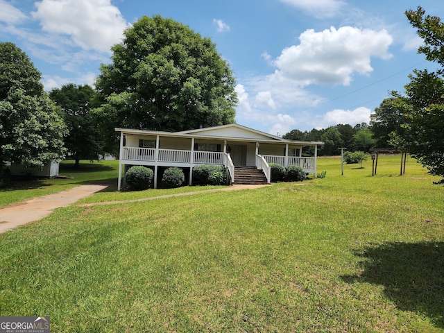 715 Bailey Jester Rd, Griffin, GA 30224 - view of front of home with a porch, a front lawn, and driveway