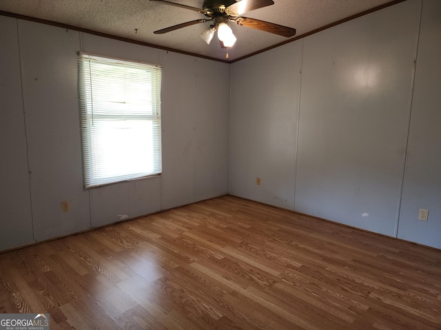 715 Bailey Jester Rd, Griffin, GA 30224 - unfurnished room featuring wood finished floors, ceiling fan, a textured ceiling, and crown molding