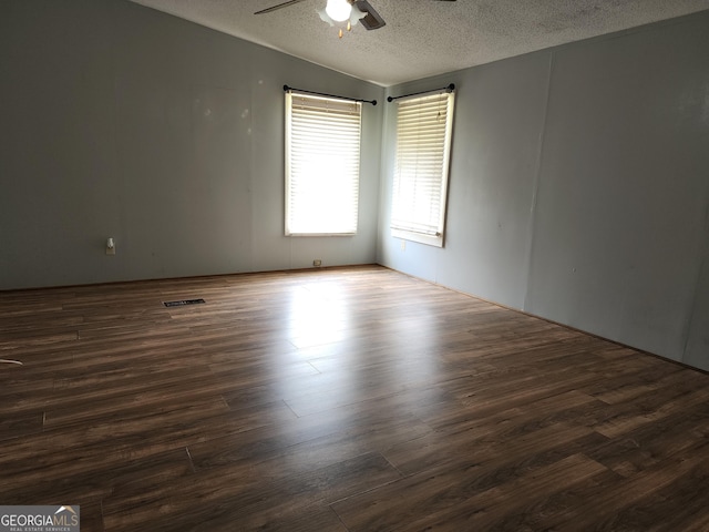 715 Bailey Jester Rd, Griffin, GA 30224 - empty room featuring a textured ceiling, a ceiling fan, and wood finished floors