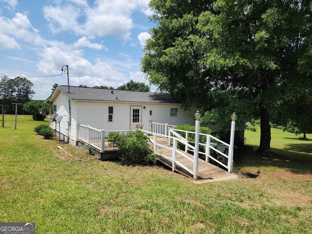 715 Bailey Jester Rd, Griffin, GA 30224 - back of house featuring a yard and a wooden deck