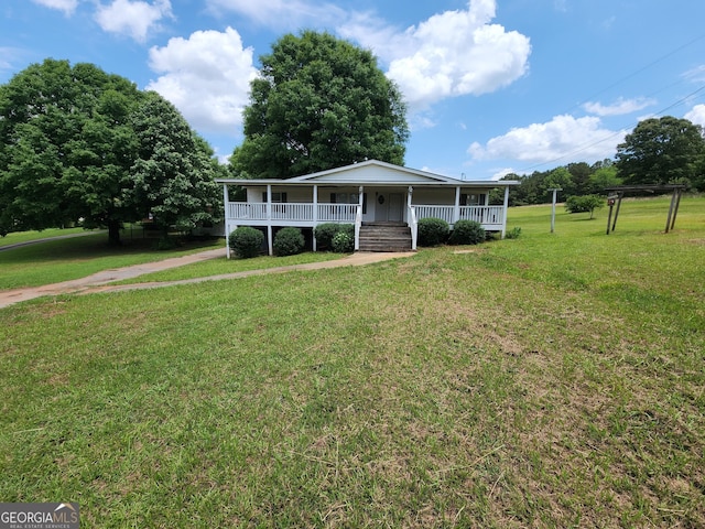 715 Bailey Jester Rd, Griffin, GA 30224 - view of front of property with covered porch and a front yard